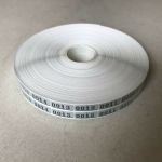 Twin-check labels 5000 pairs for film-processor